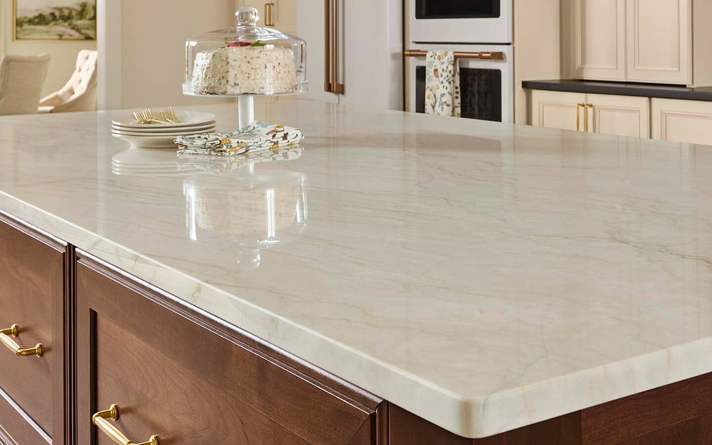 A creamy white quartzite countertop on a kitchen island
