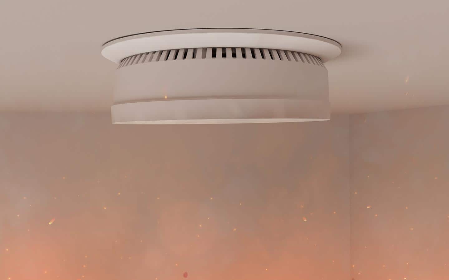 A smoke detector on a ceiling has smoke and particles floating around it. A smoke detector on a ceiling has smoke and particles floating around it.