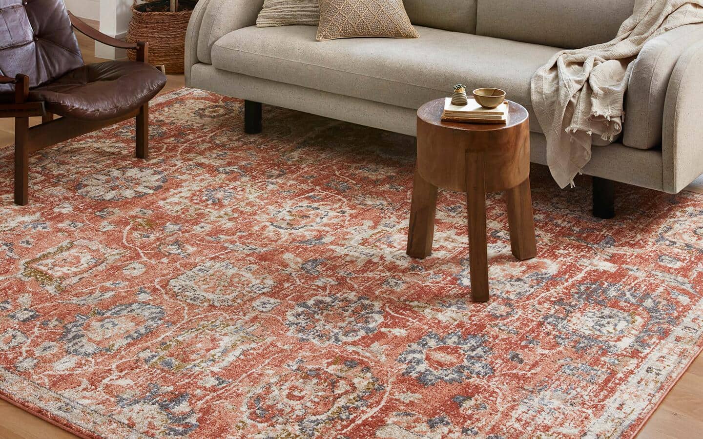 A Persian Rug rug lays on the floor of a living room.