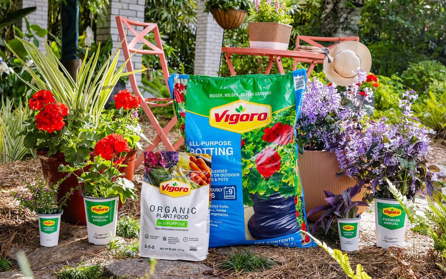 Soil, plants and other materials placed next to a small bistro set. Soil, plants and other materials placed next to a small bistro set.
