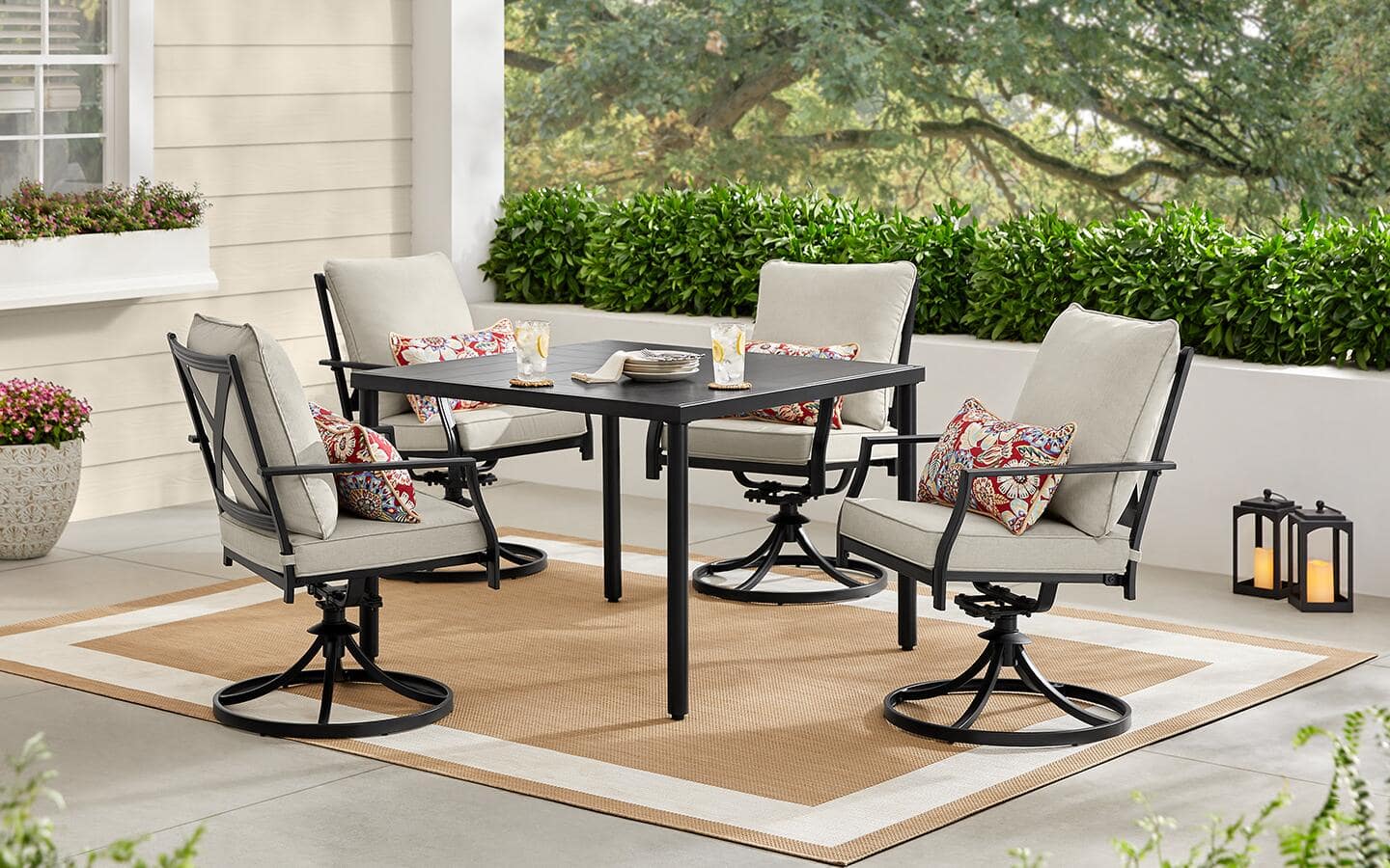 An outdoor patio set on an outdoor rug in spring