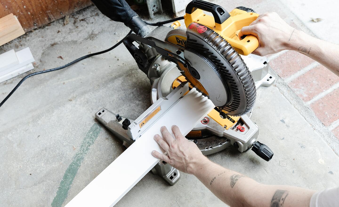 A person cutting boards with a circular saw.