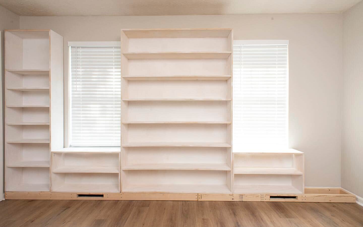 The fourth part of a built in shelving unit is installed.