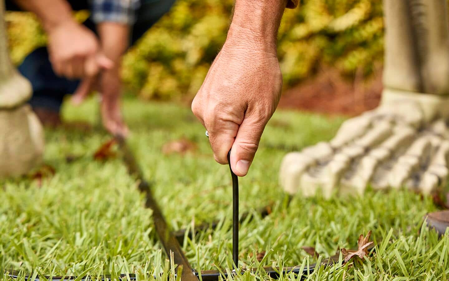 Support pins are placed into the ground at the base. Support pins are placed into the ground at the base.