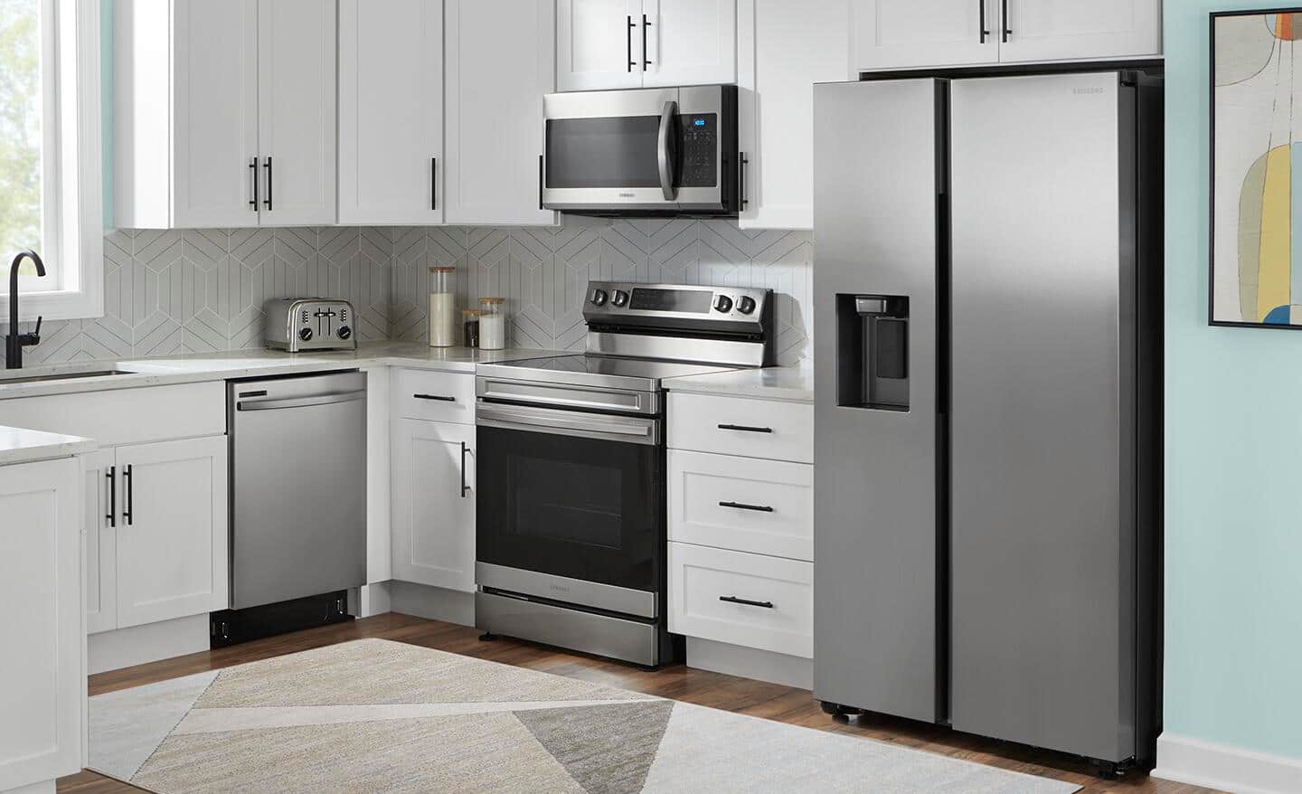 A stainless steel standard refrigerator fit into built-in cabinets.