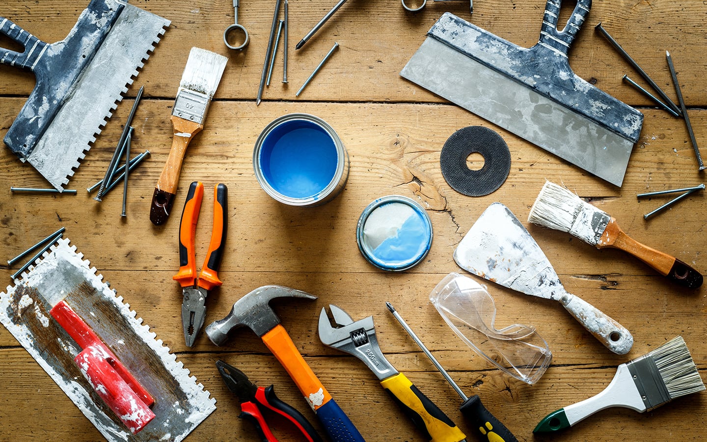 Tools and materials for accent wall construction, including paint and safety glasses. Tools and materials for accent wall construction, including paint and safety glasses.