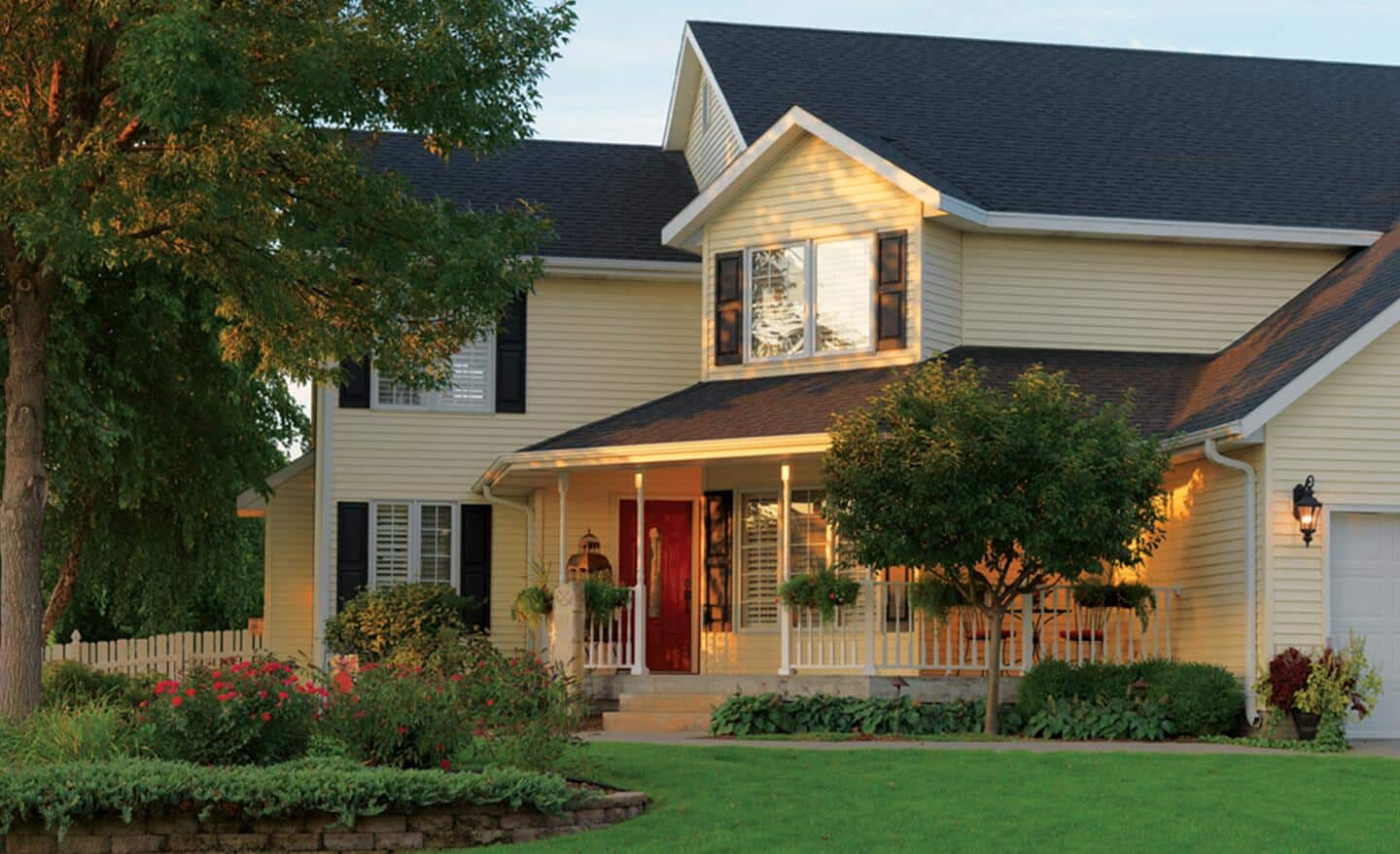 A family home in a suburban neighborhood featuring vinyl siding.