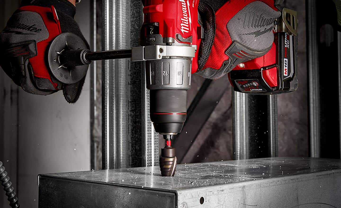 A specialty drill bit drilling through metal. 