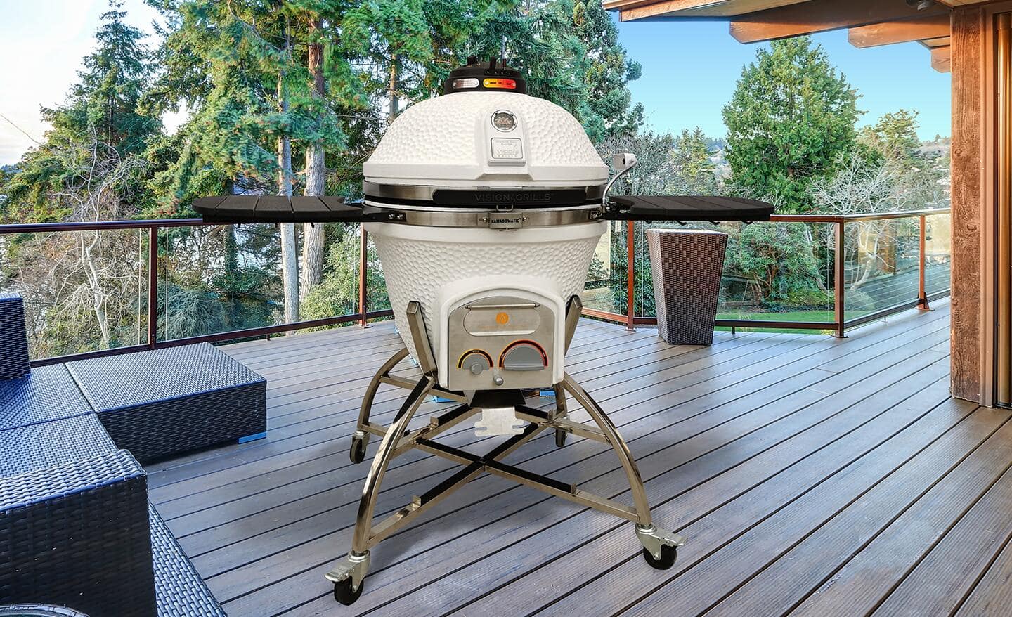 A white kamado grill stands on a patio.
