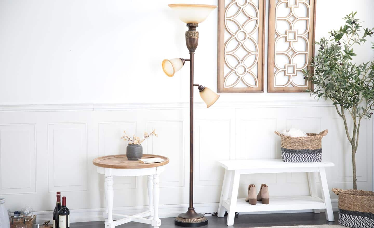 A task floor lamp extends over a small table. 