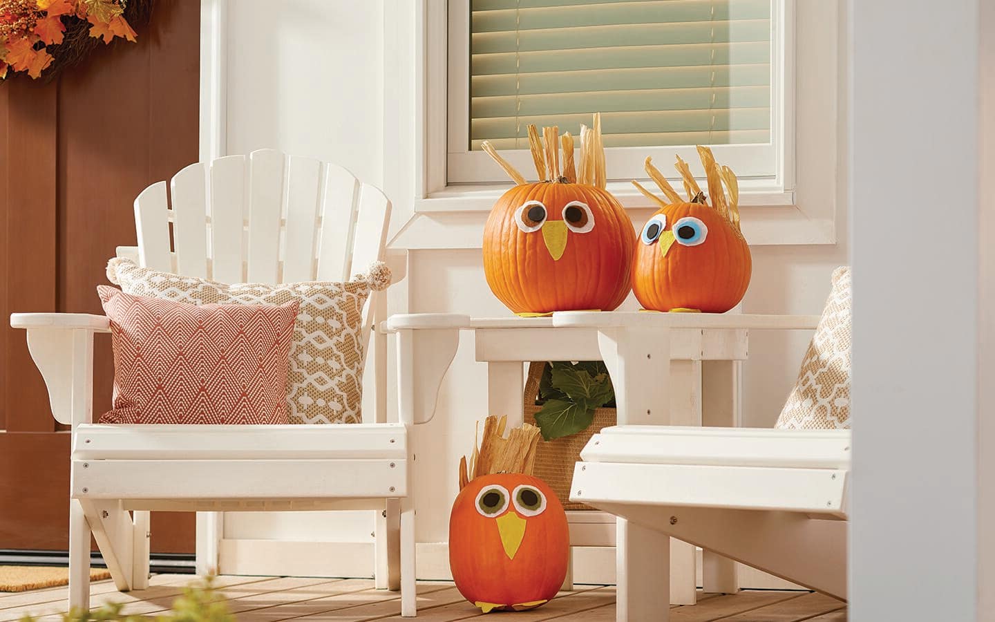 Pumpkins decorated with silly faces made from paper.