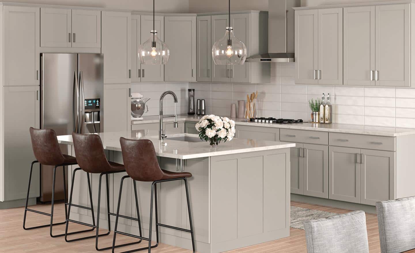 A kitchen featuring cabinets in a shaker gray finish.