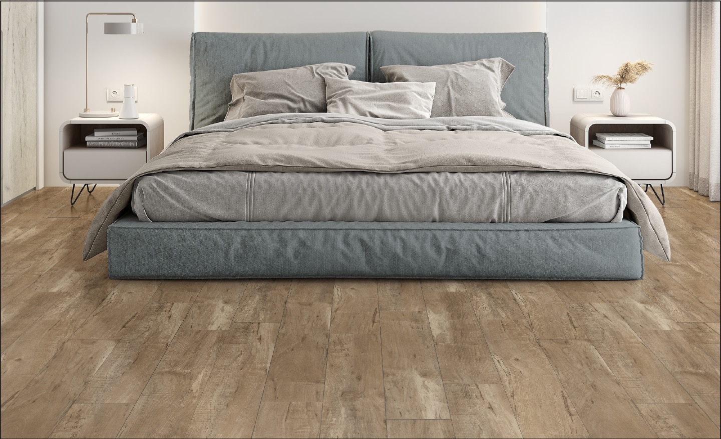 Laminate flooring that looks like wood is installed under a king-sized bed.
