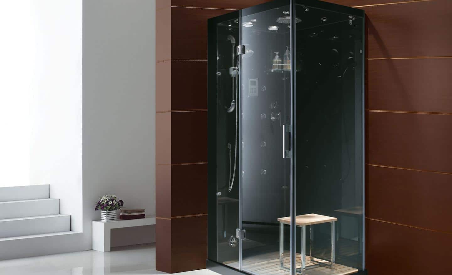 A steam shower door installed in a bath with paneled walls.