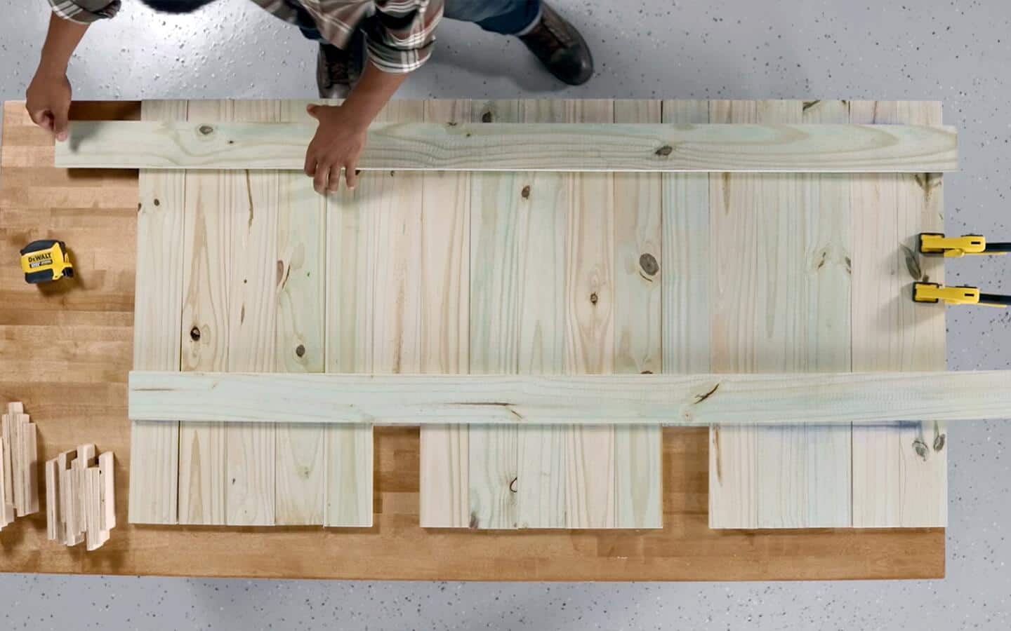 Wood pieces being assembled to form an outdoor sofa's seat back. Wood pieces being assembled to form an outdoor sofa's seat back.