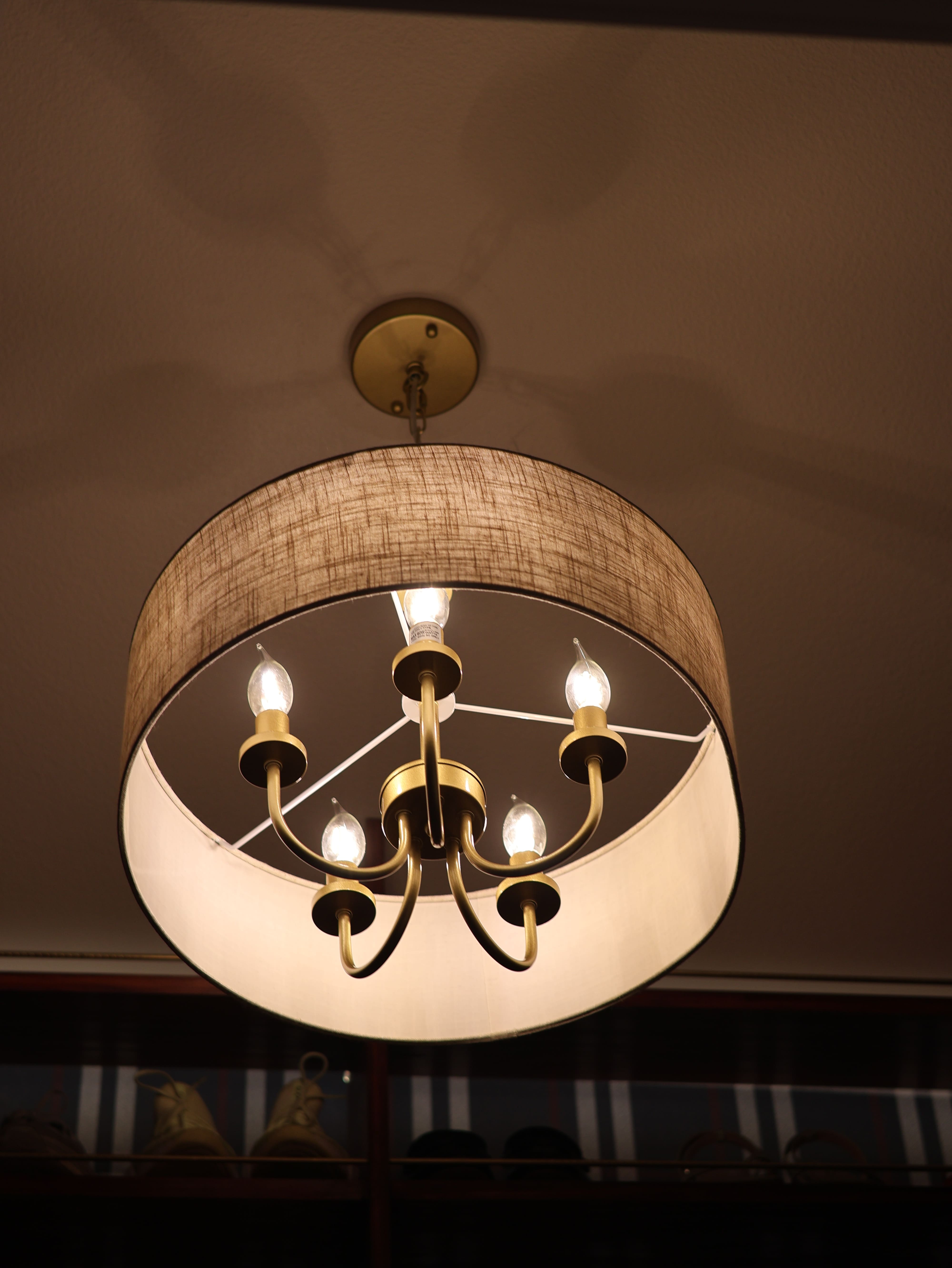 A chandelier casting ambient lighting in a closet.