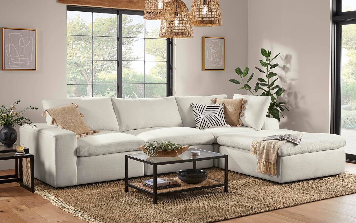 A monochromatic living room with a textured rug.