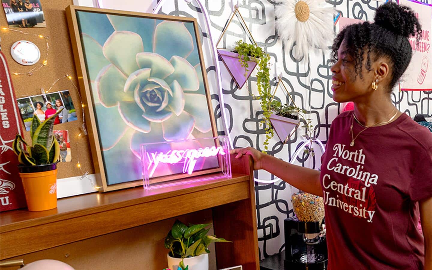 College student admiring her unique wall art, lighting and other decor. College student admiring her unique wall art, lighting and other decor.