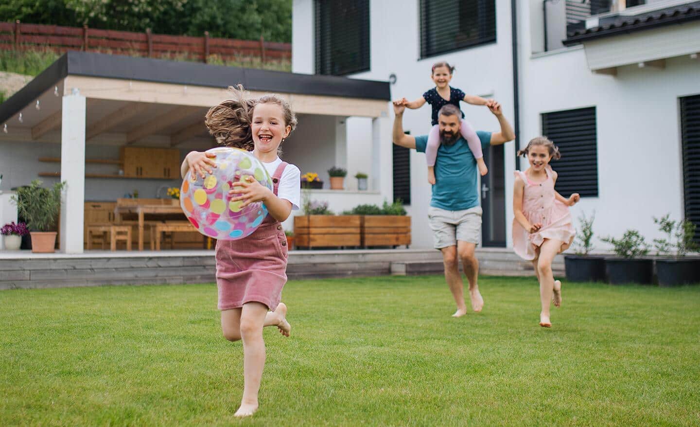 Family having fun on their lawn. Family having fun on their lawn.