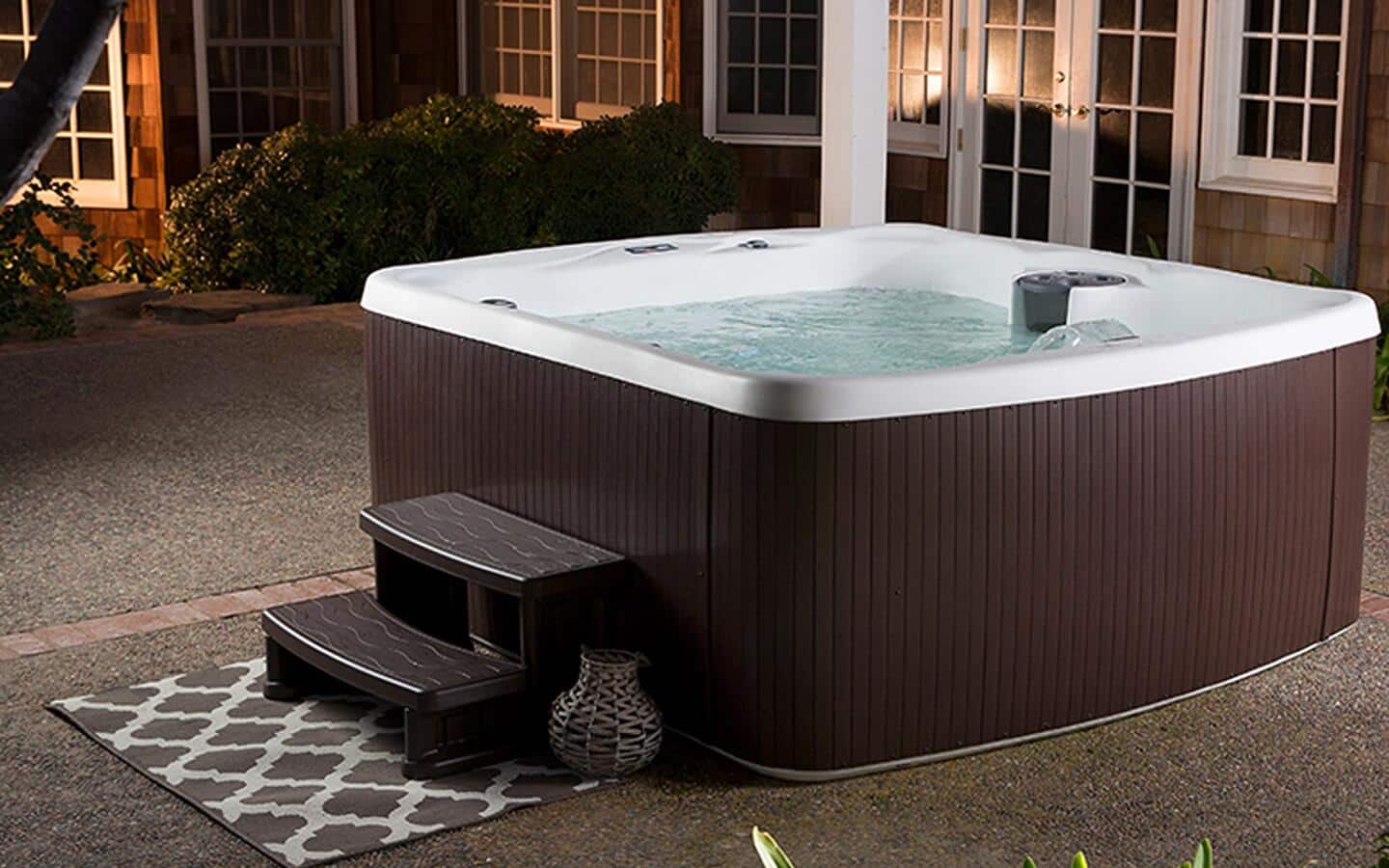 A hot tub installed on a patio.
