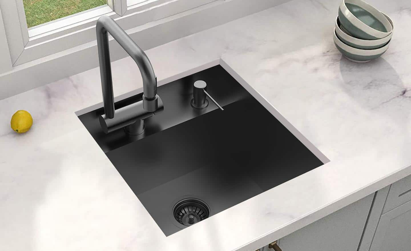 A black-basin bar sink installed in a counter.