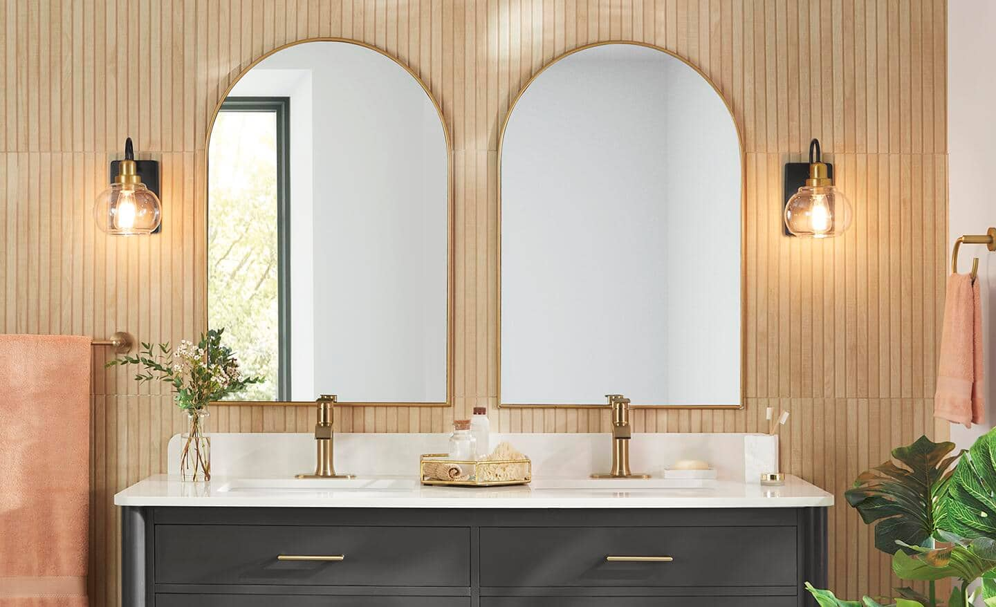 Two mirrors above a double vanity.