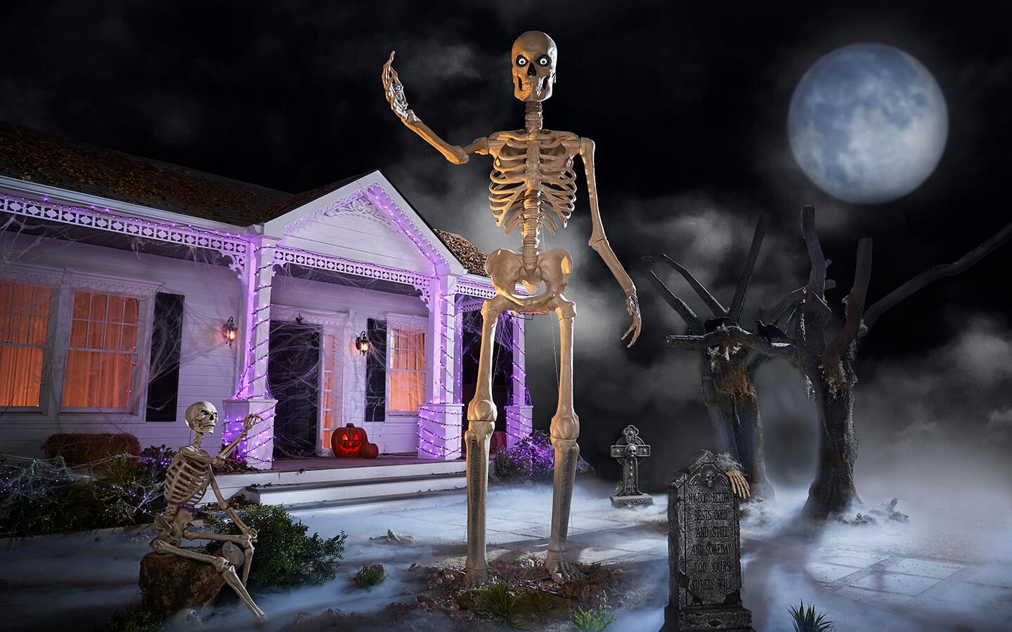 A 12-foot skeleton posed in front of a decorated porch. A 12-foot skeleton posed in front of a decorated porch.