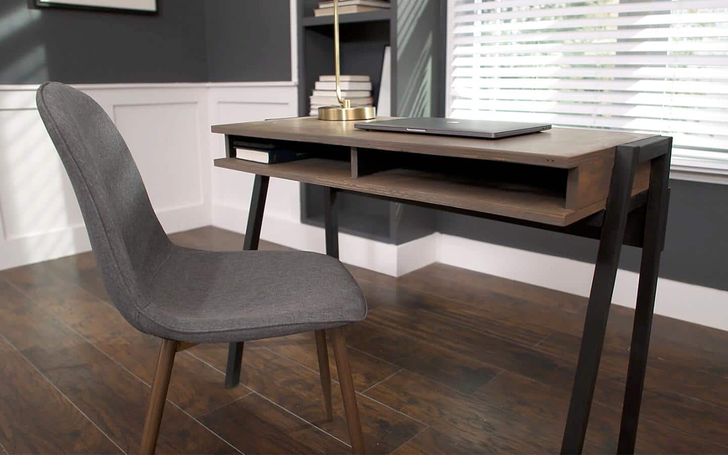 A finished DIY desk and a chair in an office.