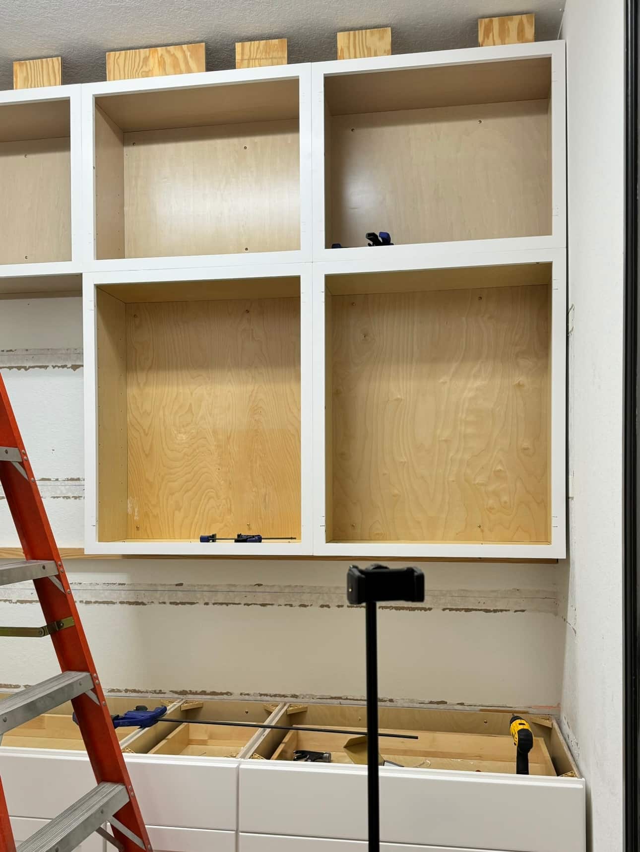 Unfinished cabinets with ladder