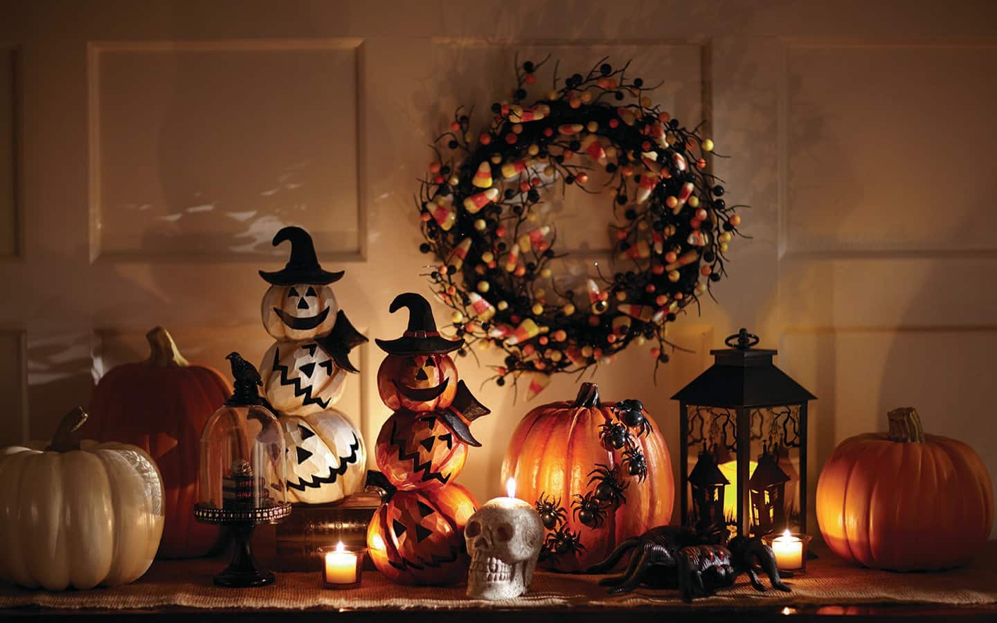 Foam pumpkins decorated and displayed on a tabletop.