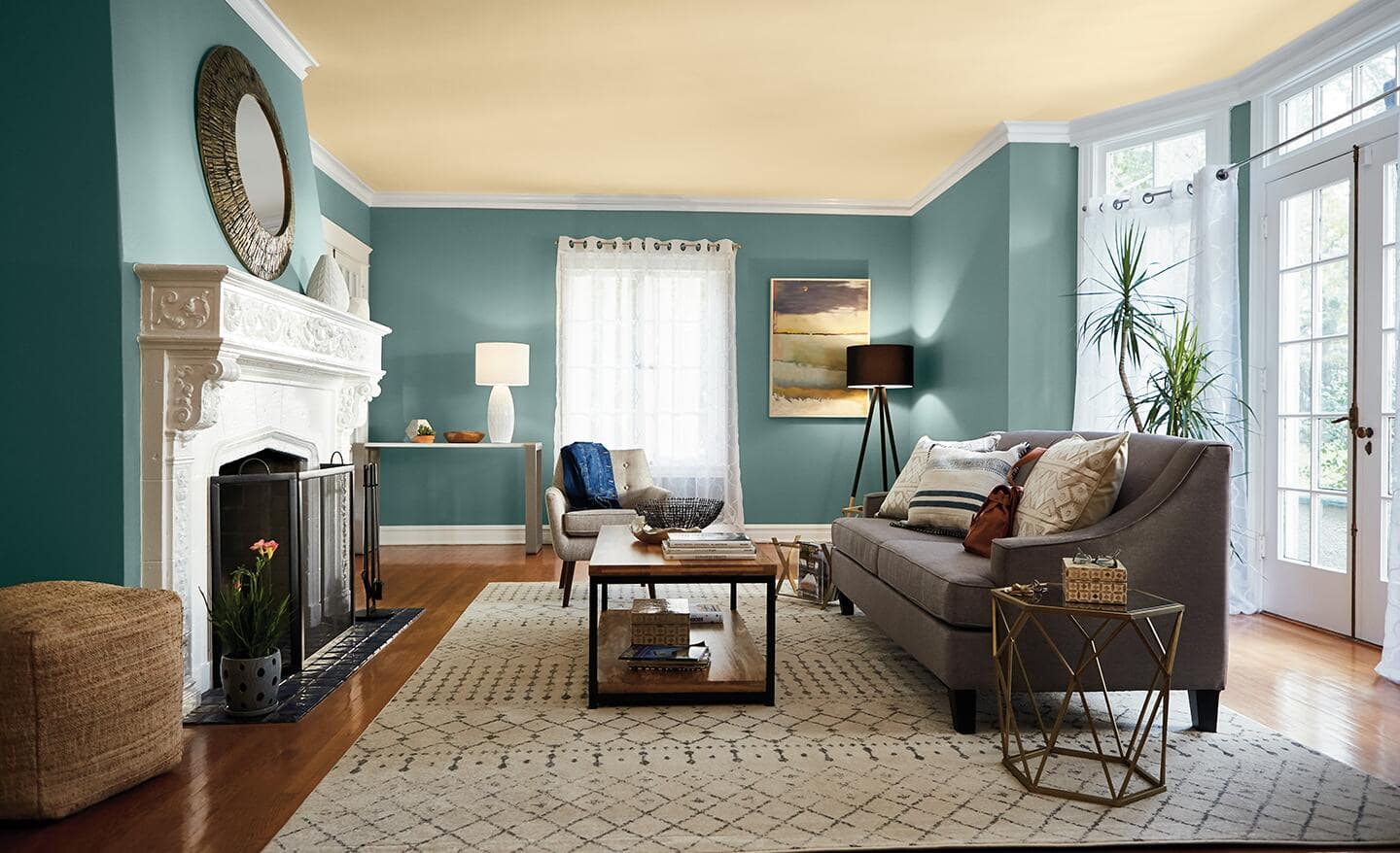 A living room ceiling is painted light cream to complement its green walls. A living room ceiling is painted light cream to complement its green walls.