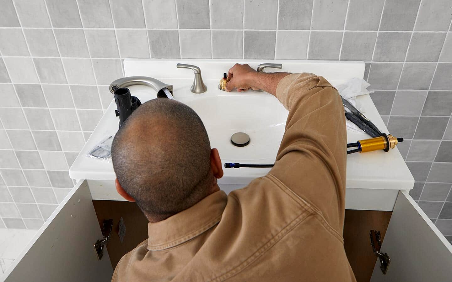 Person installing the new seat valve. Person installing the new seat valve.