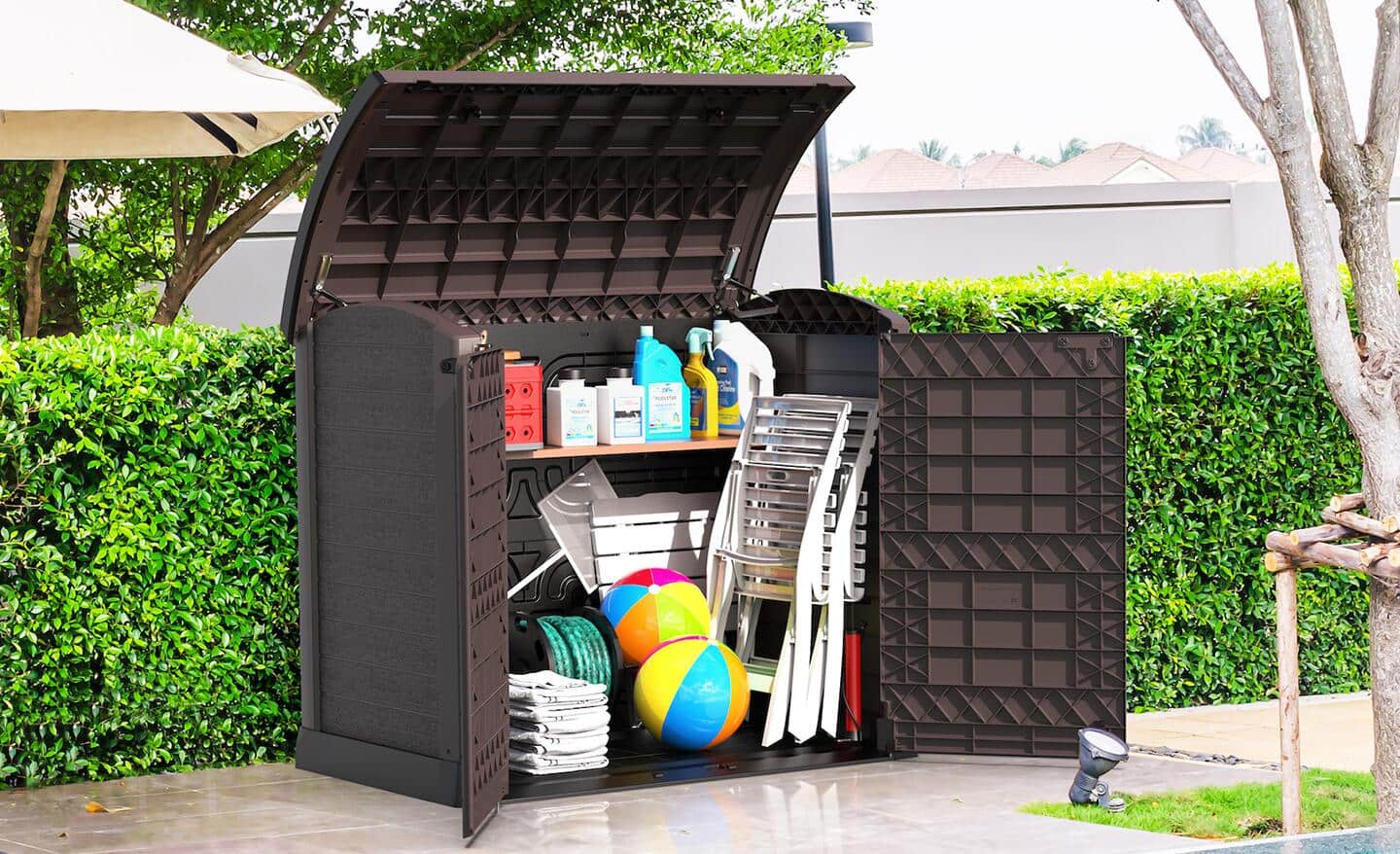 A deck box holds gardening supplies, patio chairs and beach balls