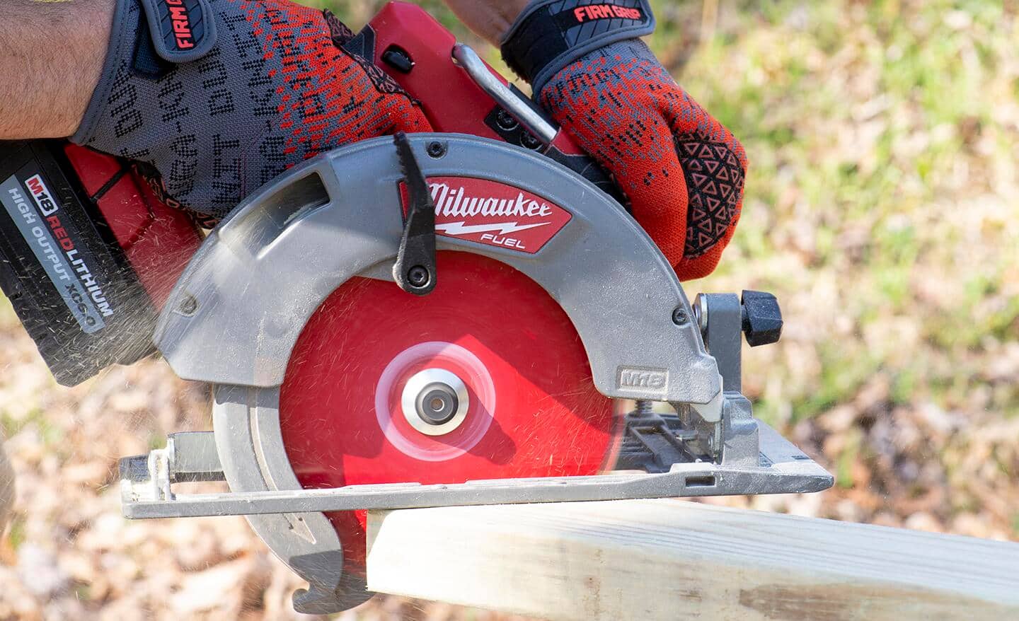A circular saw being used to cut lumber.