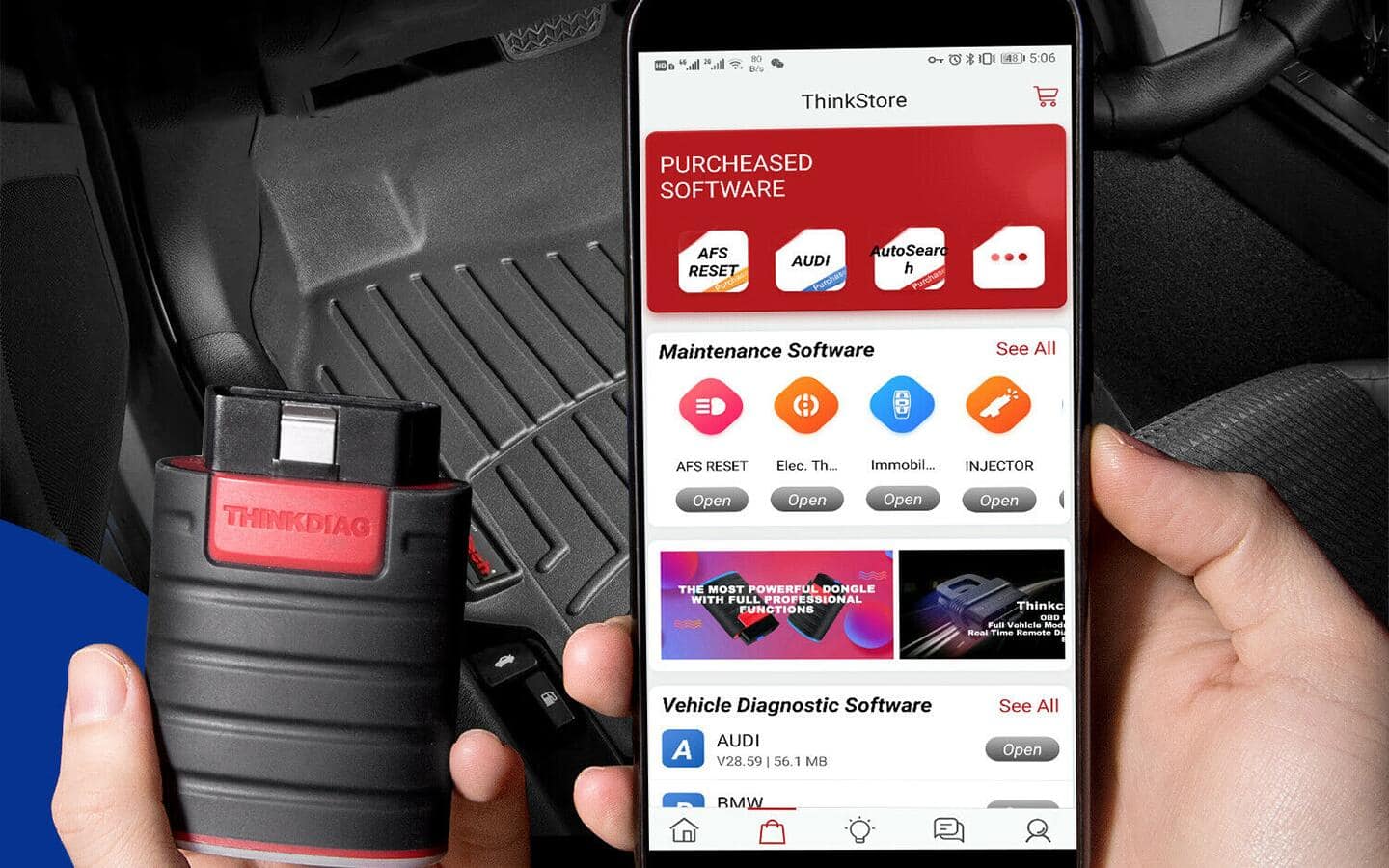 A person holding an OBD2 Scanner. A person holding an OBD2 Scanner.