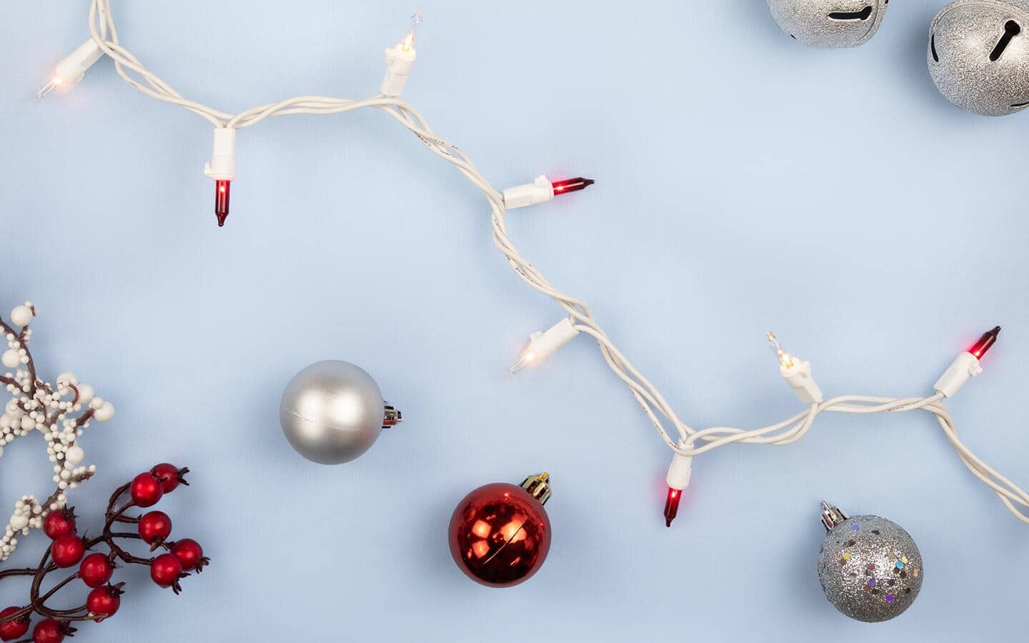 A string of mini lights placed on a white table. A string of mini lights placed on a white table.