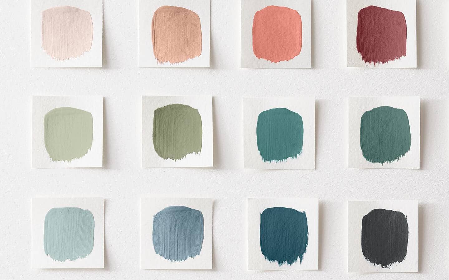 A grid with paint samples in tones of pink, green and blue A grid with paint samples in tones of pink, green and blue
