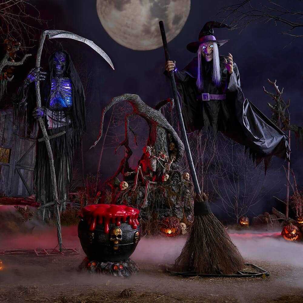A Halloween scene featuring 12 foot animatronics of a Reaper and a Hovering Witch.
