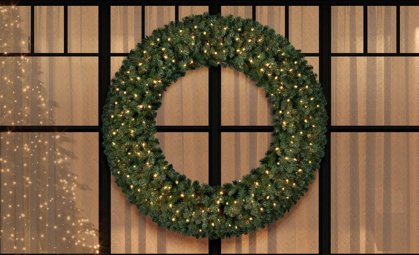 A wreath hanging on a window. A wreath hanging on a window.