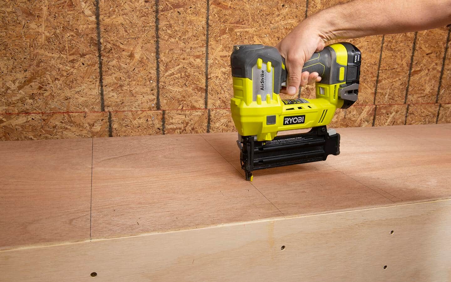 An 18 gauge Ryobi nailer is used to attach the back to a shelving unit.