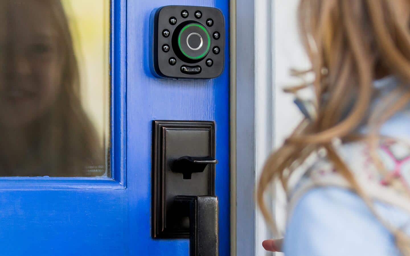 Someone using a camera with a smart door. Someone using a camera with a smart door.