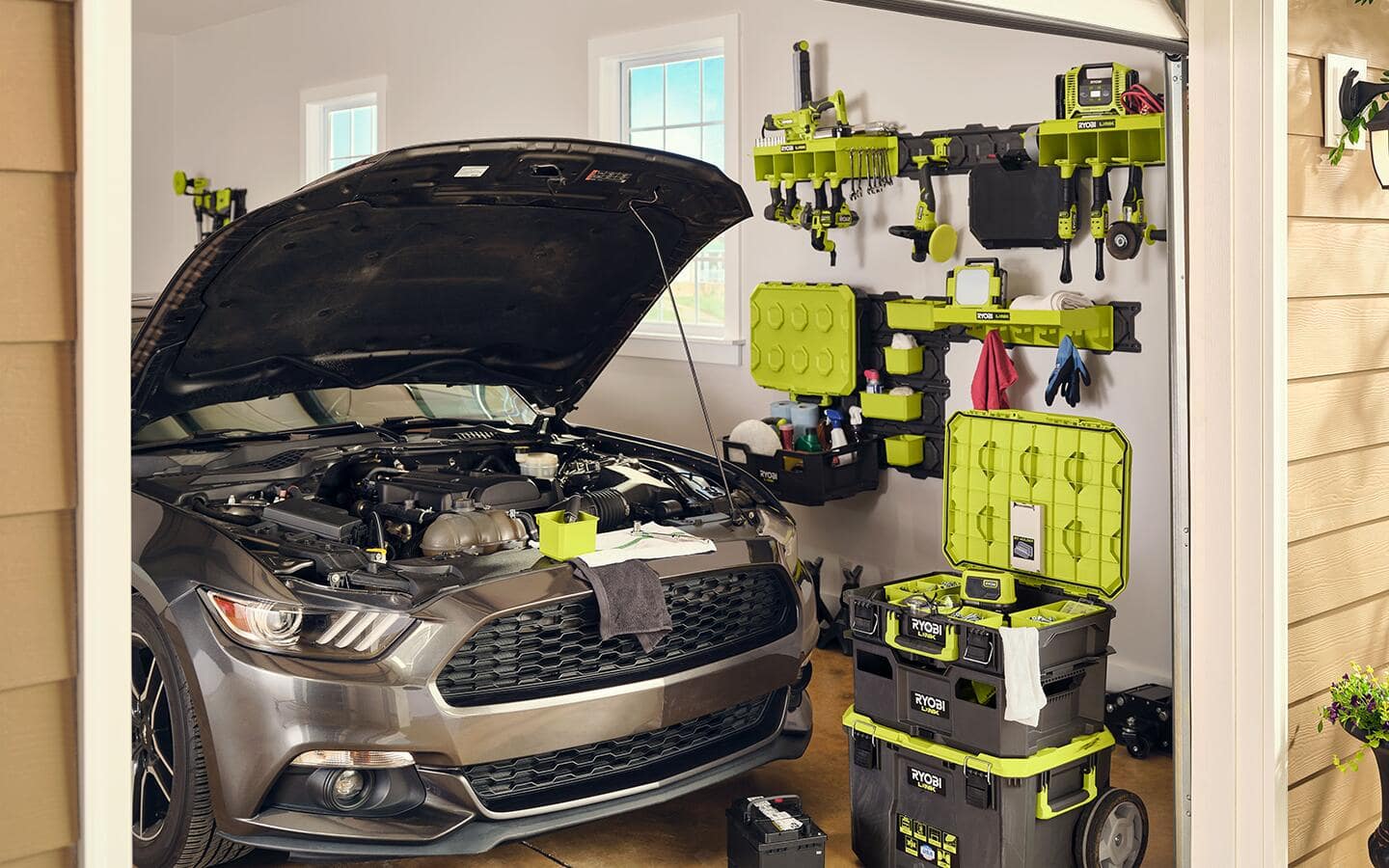 A modular tool storage system with tools and accessories for maintaining a car.