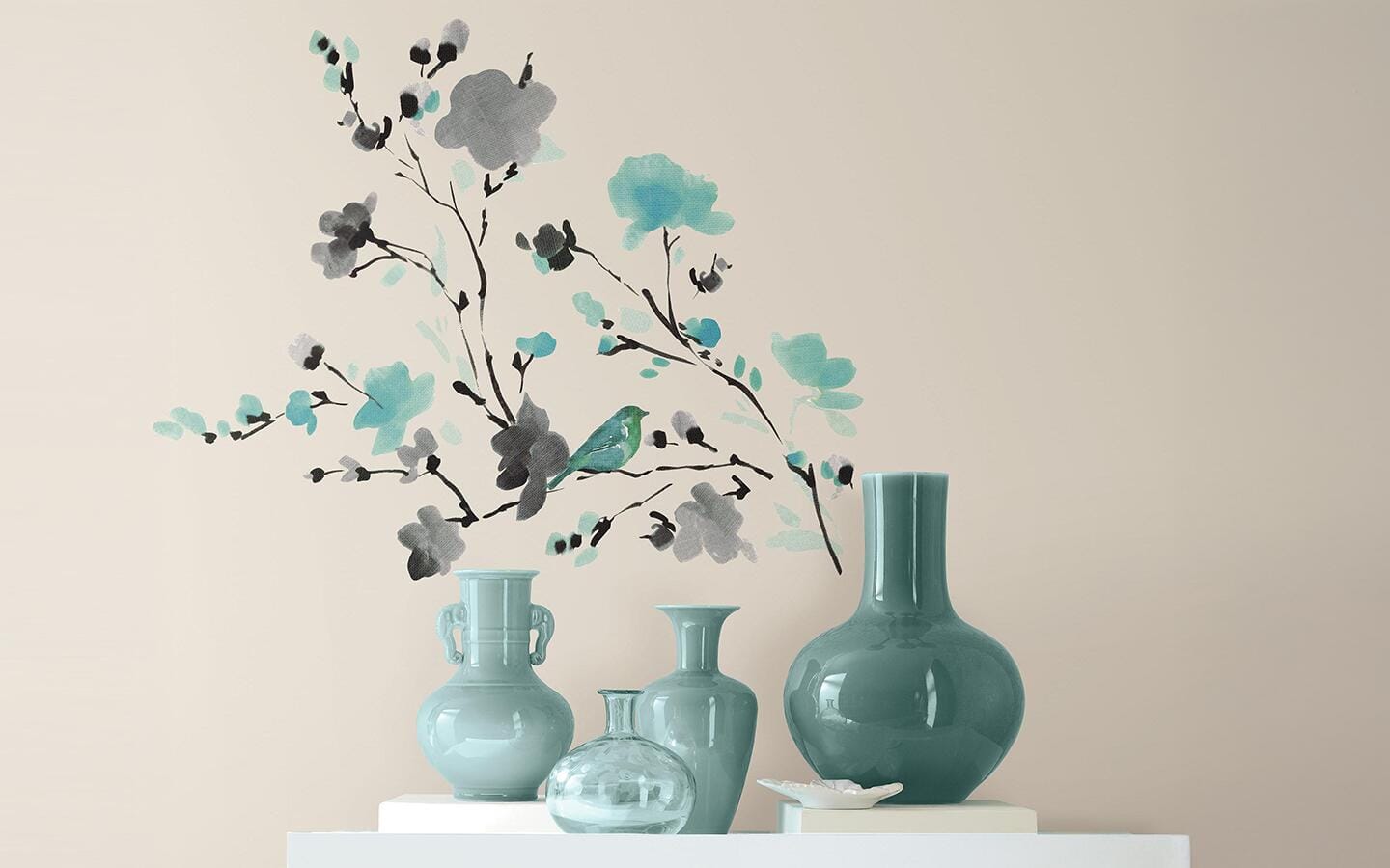 Wall decals of blue flowers above vases on a table Wall decals of blue flowers above vases on a table