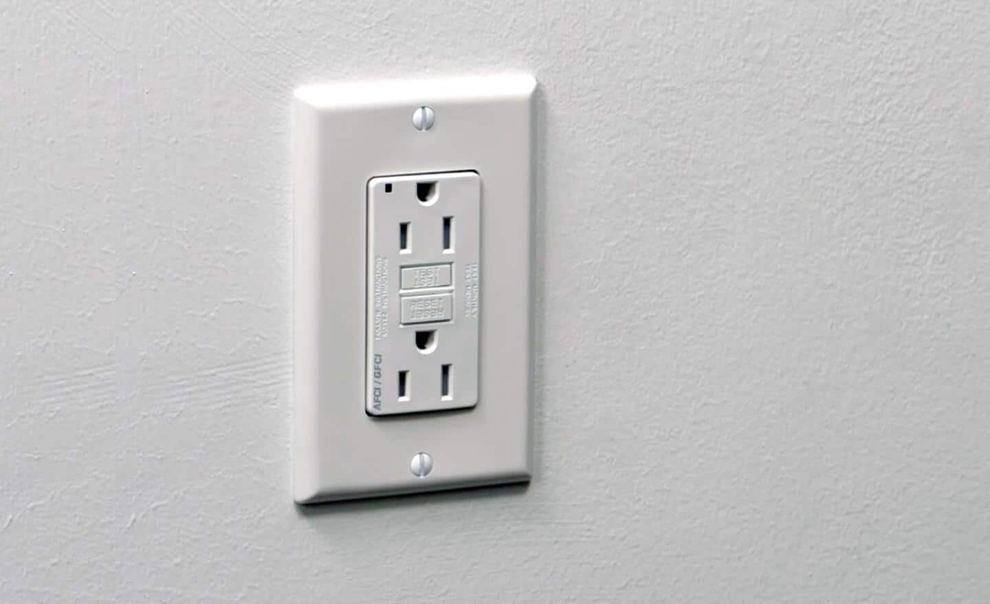 A split circuit receptacle installed on a wall.