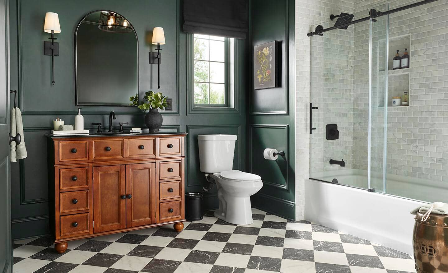 A well-designed bathroom with green walls, patterned flooring and a tiled shower/bathtub combo.