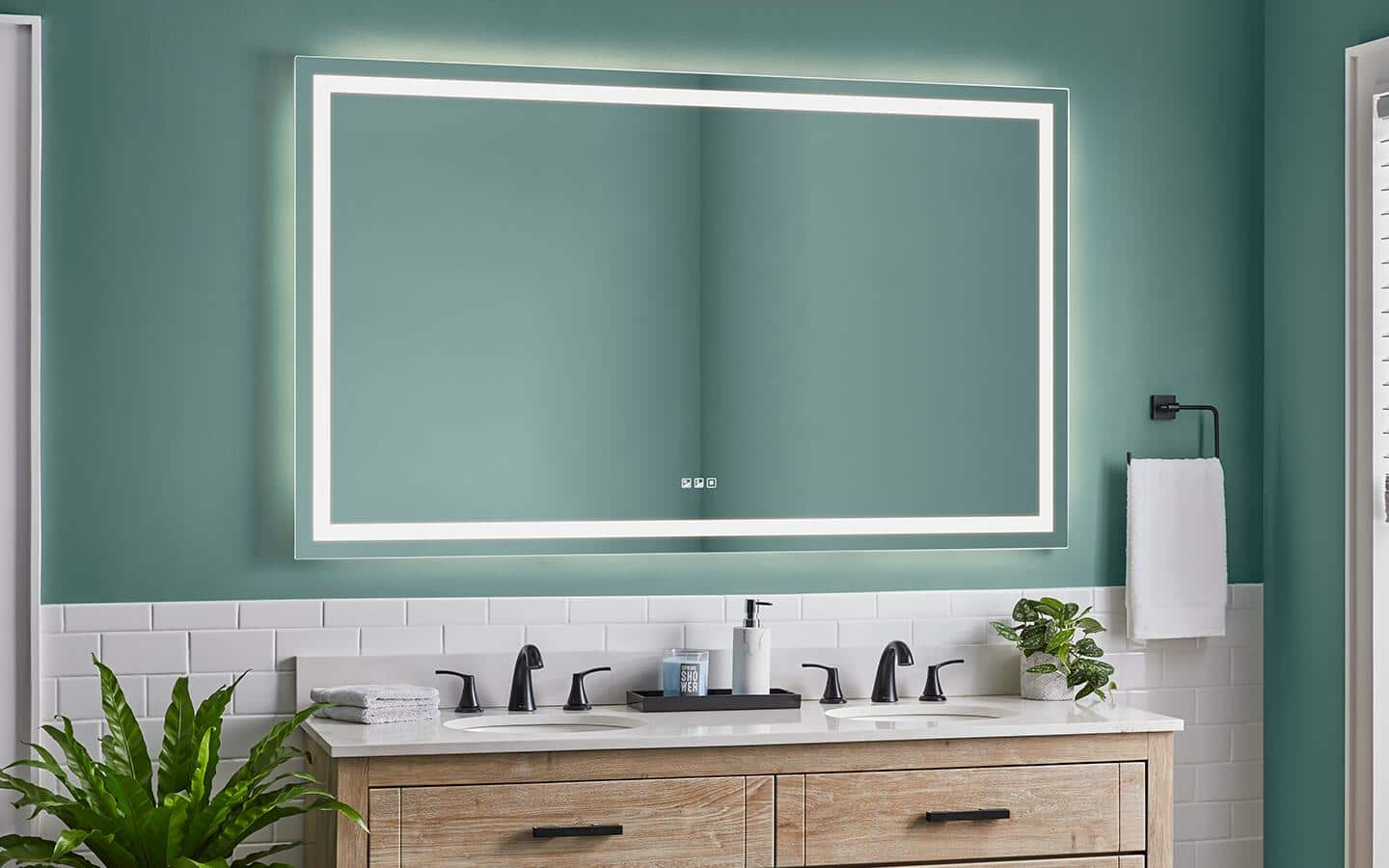 A large LED light and vanity mirror combination hanging over a sink in a bathroom. A large LED light and vanity mirror combination hanging over a sink in a bathroom.