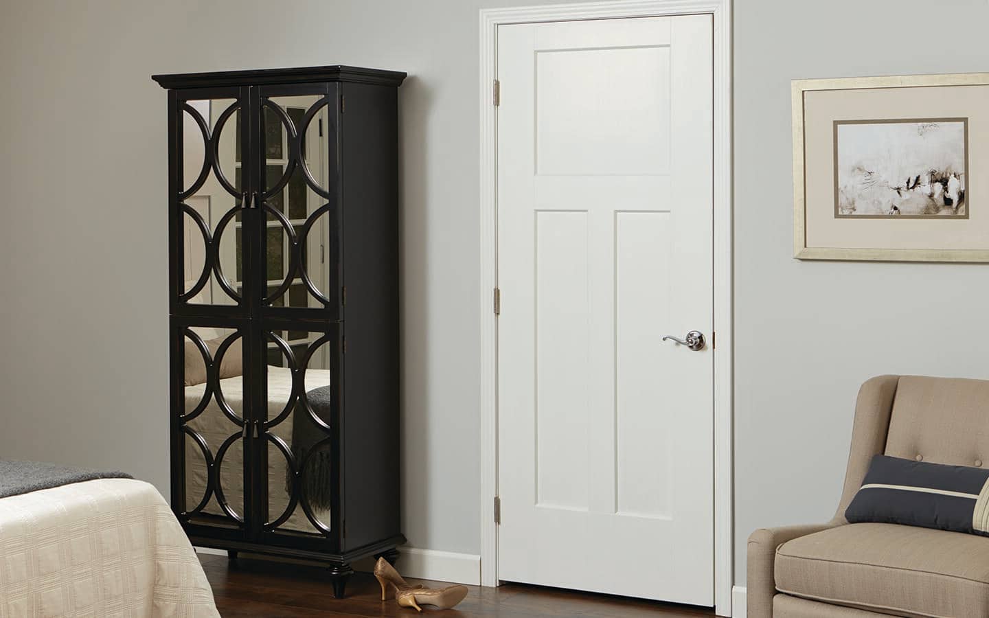 An interior door installed next to a bookcase.