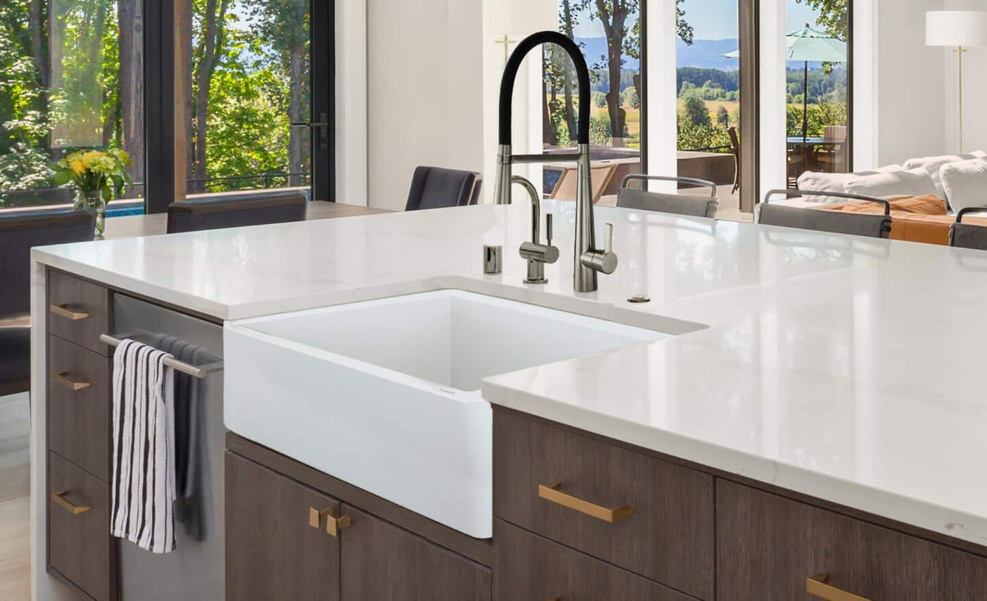 A single-bowl, farmhouse kitchen sink in white granite.