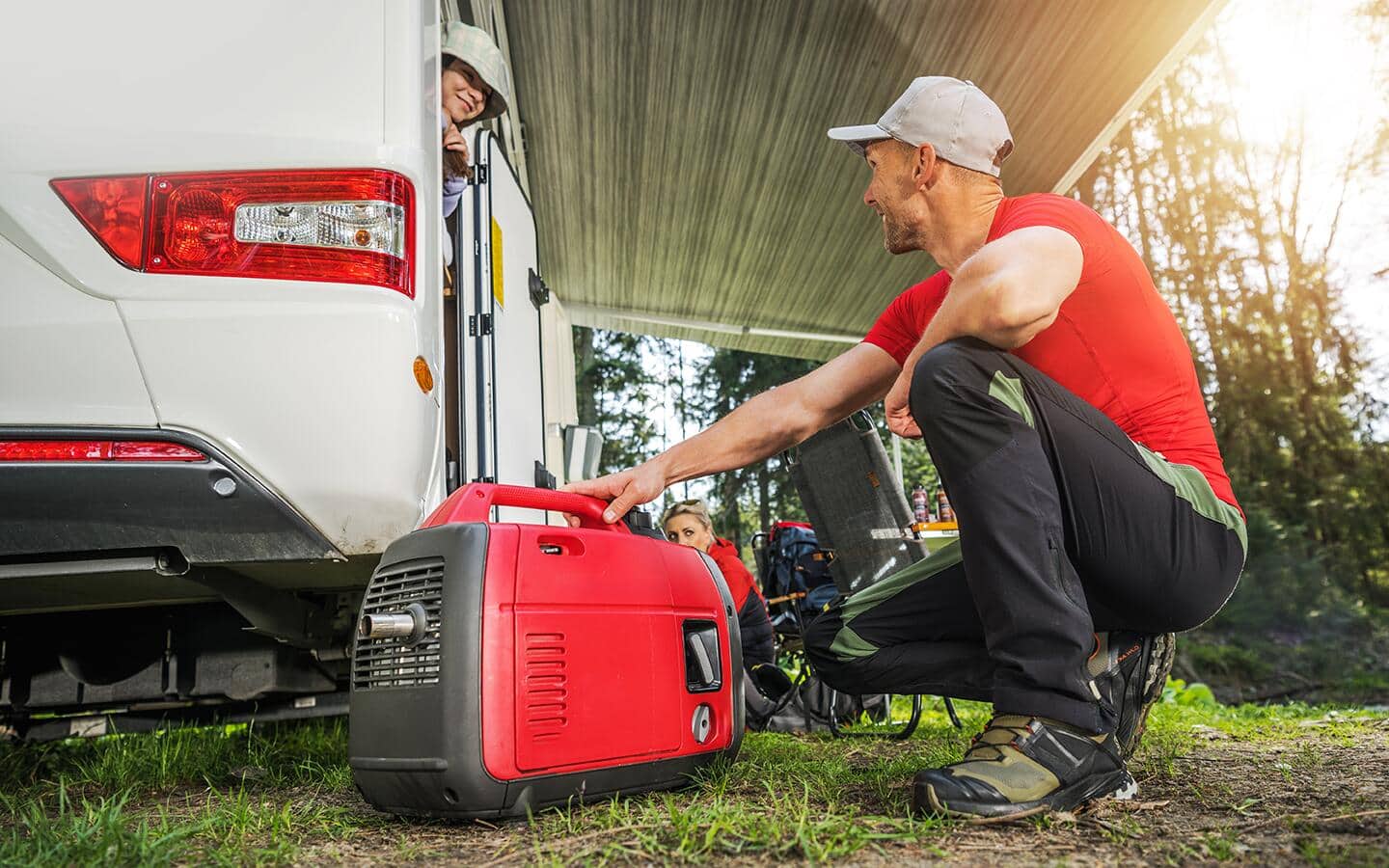 A person walking with a portable generator. A person walking with a portable generator.