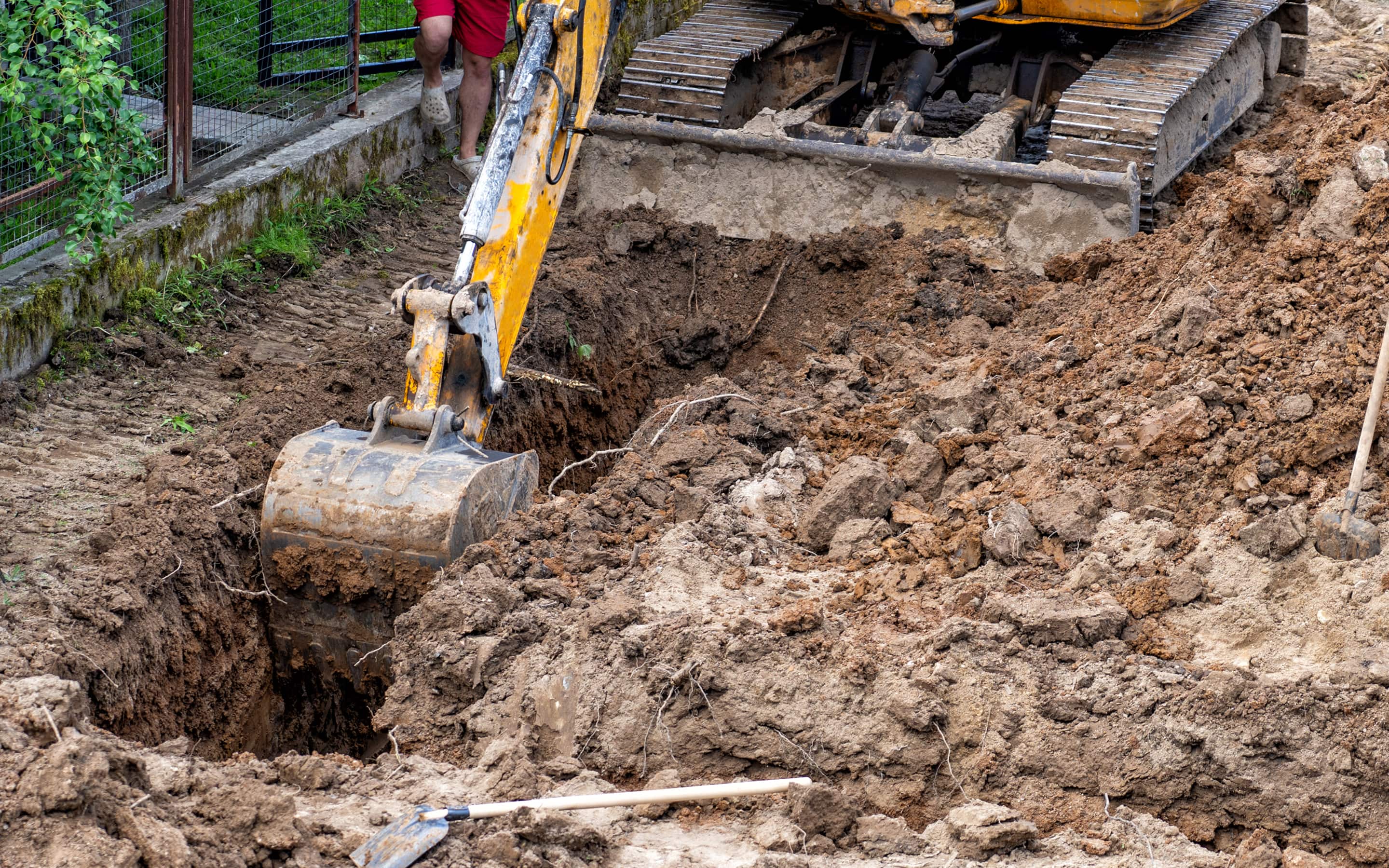 A Pro operating an excavator to dig a site. A Pro operating an excavator to dig a site.